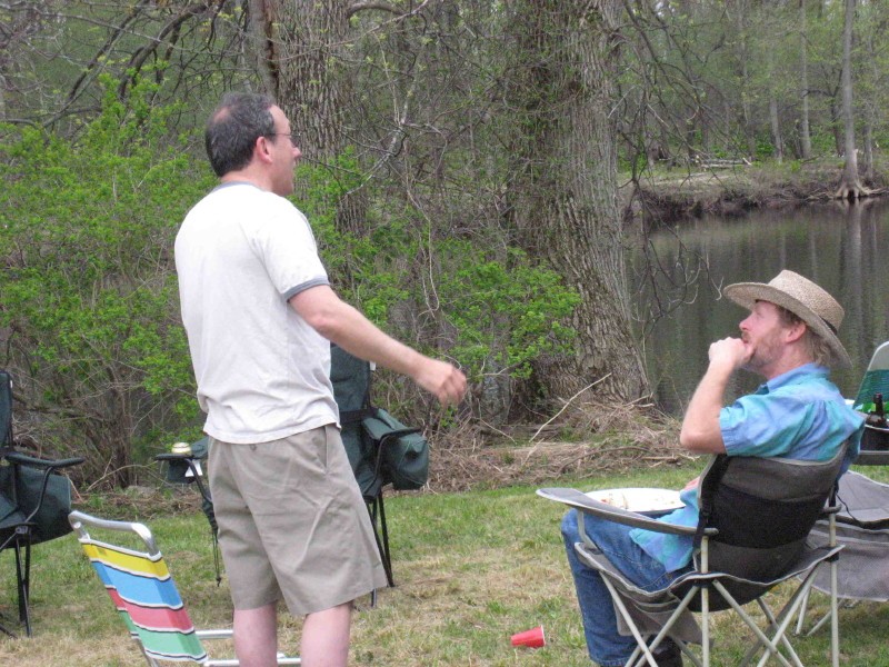 fishy-story1.jpg - Steve Koons telling Brian Coots a whopper of a fish story