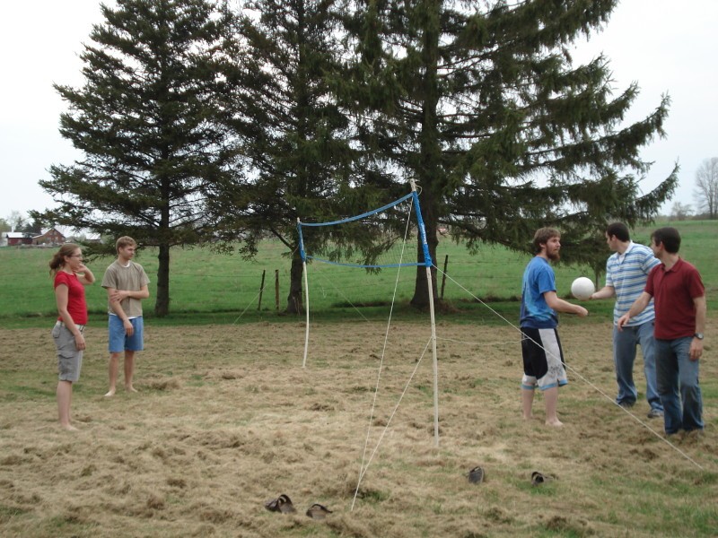 picnic08-22.jpg - The volleyball match begins (Kelly O'Connoll '08, Ryan Wolfe '09, Taylor McElligott '09, Brendan Mitchell '09)